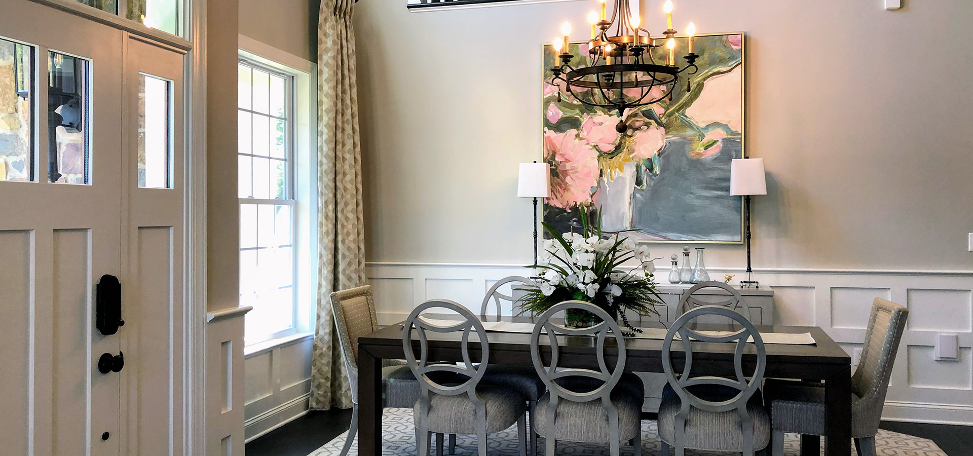 dining room with art and chandelier